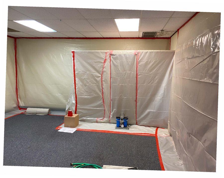 Finished containment with negative-air filtration running.