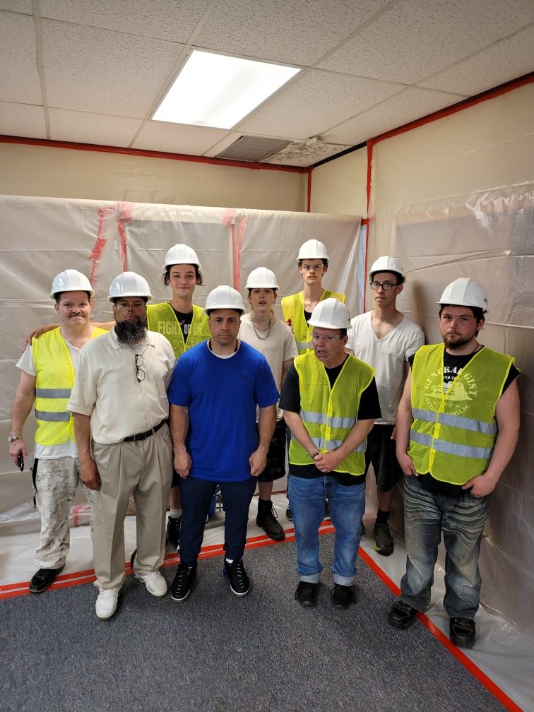 The AC3 abatement training cohort inside the completed containment.