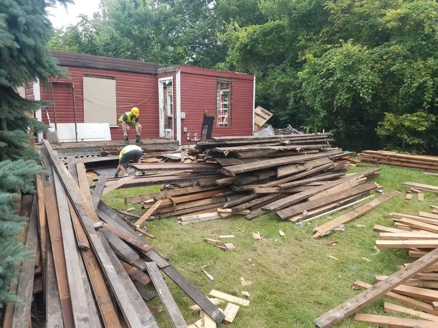Reclaimed lumber sorted and stacked for reuse.