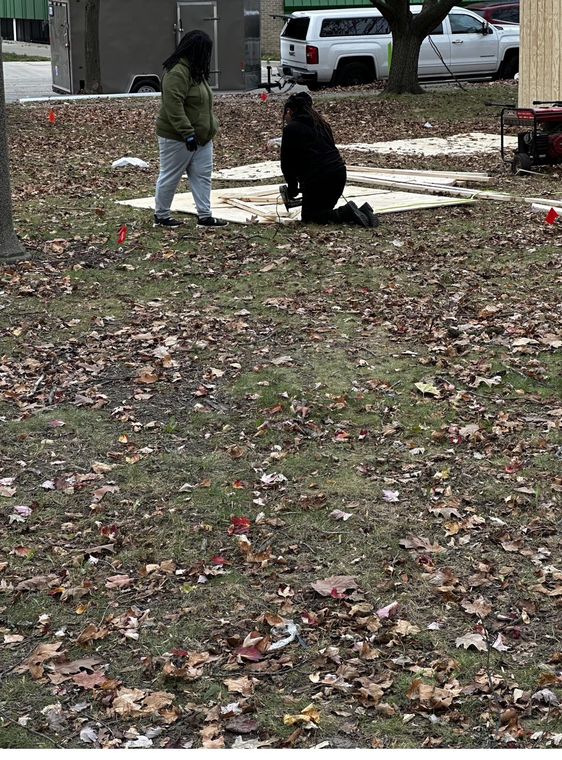 Laying out the bases on the grass at Reutter Park, downtown Lansing.