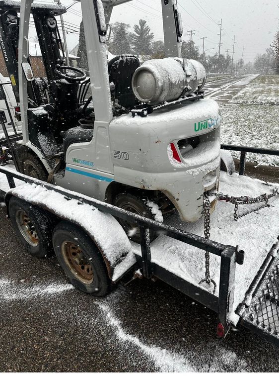 Chained to the trailer and out through the snow toward downtown.